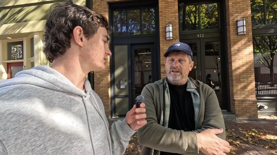 Nick Shirley interviews a man outside a downtown Portland building.